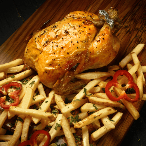 Pollo entero al spiedo con guarnición